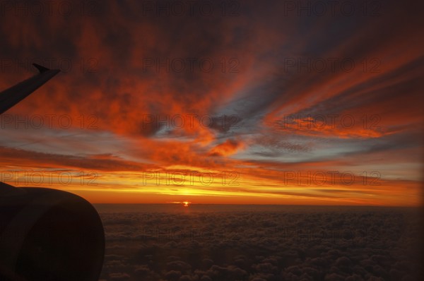 View from airplane window at sunrise