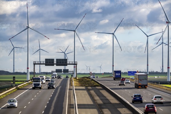 A44 motorway near Bedburg, in front of the Jackerath triangle, recultivated open-cast mining site, Garzweiler open-cast lignite mine, Königshovener Höhe wind farm near Bedburg, operated by RWE and the city of Bedburg, North Rhine-Westphalia, Germany