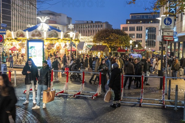Christmas market in Essen, secured by mobile anti-terrorist lock, modular, movable barrier against car and truck shooting, are opened or closed by a security guard as required, model Herner Truck Lock, HTS, on Kennedyplatz, in Essen, North Rhine-Westphalia, Germany