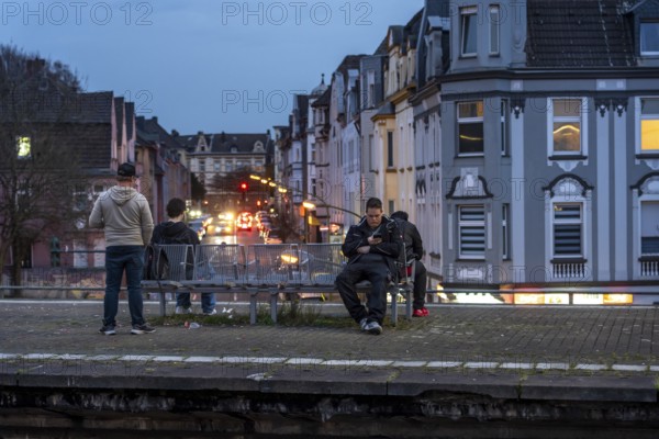 Essen-Steele S-Bahn station, passengers waiting for the train late afternoon, in autumn, Essen, North Rhine-Westphalia, Germany
