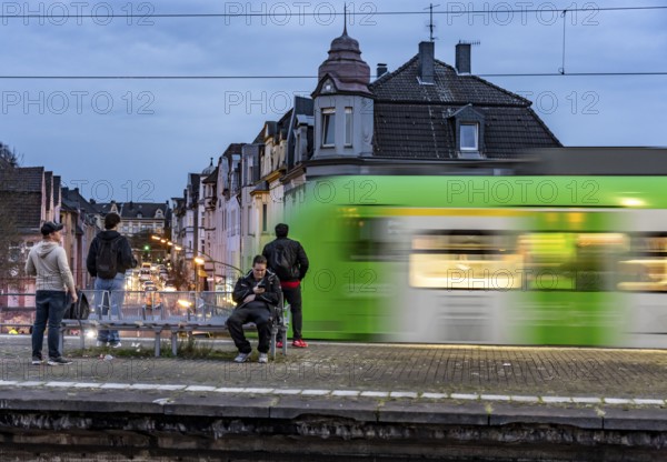 Essen-Steele S-Bahn station, passengers waiting for the train late afternoon, in autumn, Essen, North Rhine-Westphalia, Germany