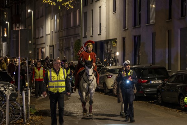 Martinszug in Essen-Rüttenscheid, the parish of St. Lambertus, Saint Martin actor on a horse, with over 500 participants, North Rhine-Westphalia, Germany