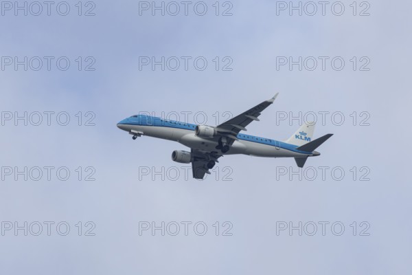 Embraer ERJ-190 jet passenger aircraft of Royal Dutch KLM cityhopper airlines in flight on approach to London city airport, England, United Kingdom