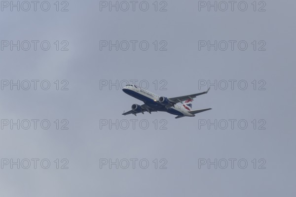 Embraer ERJ-190 jet passenger aircraft of British Airways BA CityFlyer airlines in flight on approach to London city airport, England, United Kingdom
