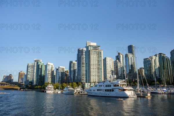 Sailing boats in marina, skyscrapers on the promenade, Coal Harbour, Vancouver, British Columbia, Canada