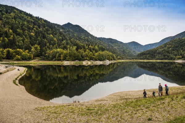 Picturesque mountain lake with water reflections in autumn, Lac de Kruth-Wildenstein, Kruth, Vosges, Alsace-Lorraine, Department of Vosges Haut-Rhin, France