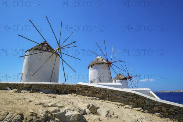 Mykonos, Cyclades, Greece - The six sixteenth-century windmills, lined up on a hill above Mykonos Town, Mykonos Chora, are the island's landmark. Mykonos is part of the Cyclades archipelago in the Aegean Sea