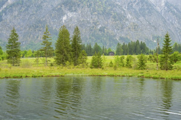 Landscape of Lake Almsee on a rainy day in spring, Salzkammergut, Austria