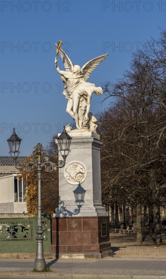 The shadow of a street lamp on the pedestals of the group of figures on the Schlossbrücke, Unter den Linden, Berlin, Germany