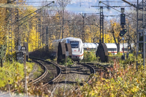 Intercity Express ICE. Open-route passenger train in the Stuttgart North Station area. Arched bridge and landscape in autumn. Stuttgart, Baden-Württemberg, Germany