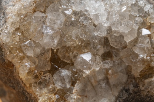 Vibrating quartz crystals mix with rock formations and capture light in a natural spring atmosphere. Geological diversity attracts the interest of enthusiasts