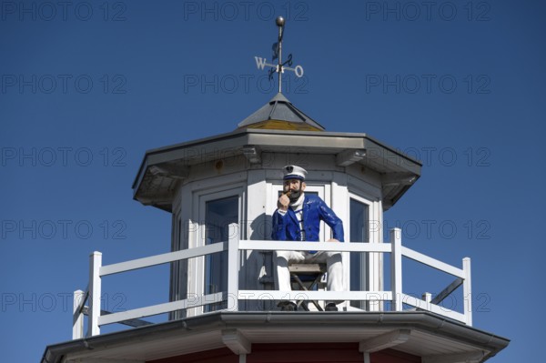 Captain figure on the balcony of a holiday home, Zingst, Darß, Mecklenburg-Western Pomerania, Germany
