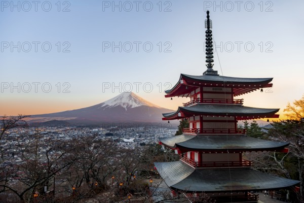 Five-story pagoda of a Shinto Shrine, Chureito Pagoda, with views of Fujiyoshida City and Mount Fuji volcano at sunset, Arakura Fuji Sengen Shrine, Arakurayama Sengen Park, Yamanashi Prefecture, Japan
