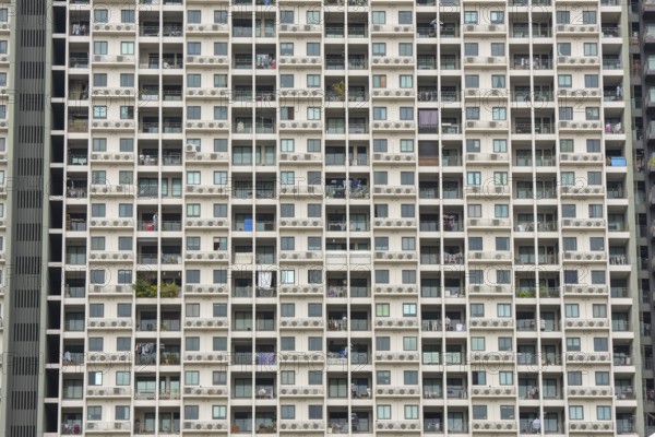 Exterior façade of a residential high-rise building of Condo U (a brand or series name of the Thai real estate developer Grand Unity Development Co., Ltd. (often abbreviated Grand U), Bangkok Yai district, the old town of Bangkok, Thailand