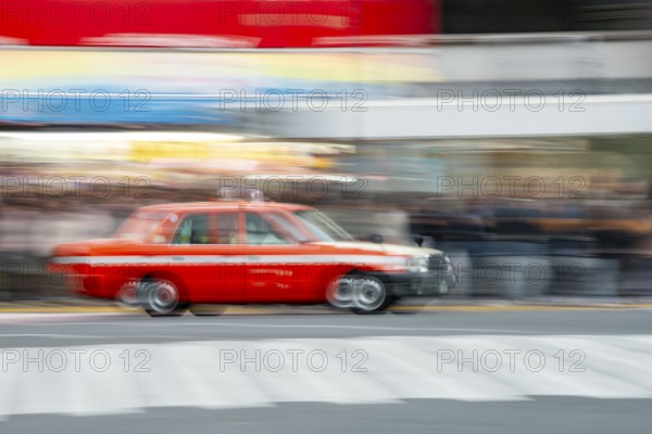 Black taxi driving, motion blur, long exposure, Shubuya Crossing, Shibuya, Tokyo, Japan