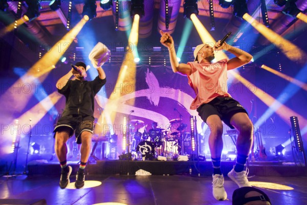 Carlito (Carlos Charlemoine) and Mal Élevé (Pablo Charlemoine), singers from Irie Révoltés live on Irieunion - Le Re-Tour pour une année! Tour in Berlin's Columbiahalle on 31.10.2025