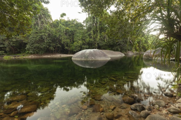Turquoise blue water between rocks in the tropical rainforest of Babinda Boulders Queensland Australia