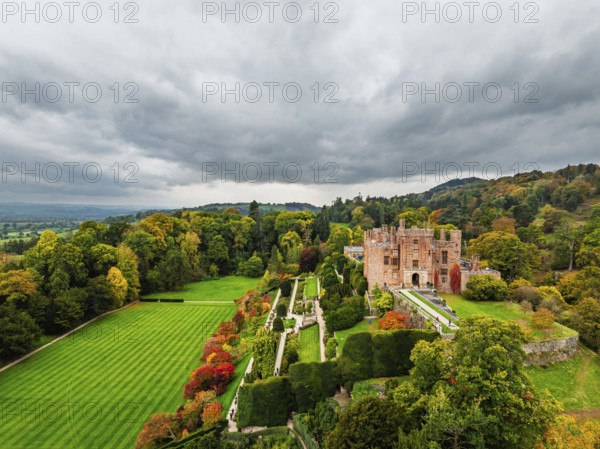 Autumn colours over Powis Castle and Garden from drone, Welshpool, Powys, Wales, England, United Kingdom