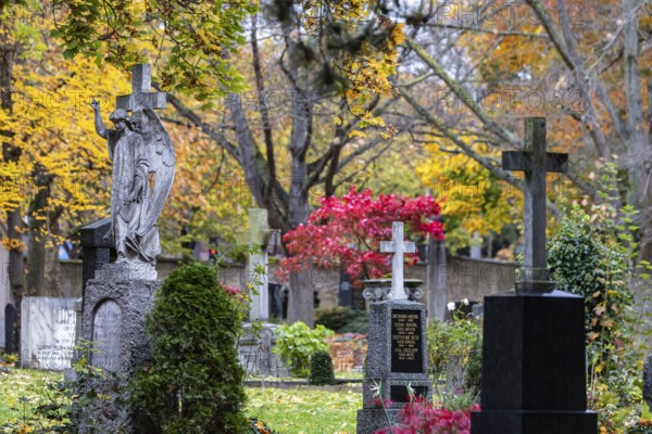 Pragfriedhof Stuttgart in autumn. November is traditionally a time for Christians to visit their graves. Symbolic photo with graves and grave decorations. Stuttgart, Baden-Württemberg, Germany