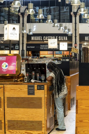 The Mercadeo da Ribeira, also known as TimeOut Market, is the best address for Portuguese specialties and international cuisine. Historic market hall at Cais do Sodré station, Lisbon, Portugal