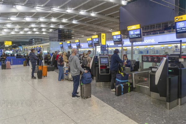 British Airways check in bag drop area, Terminal 5 London Heathrow airport, London, England, UK