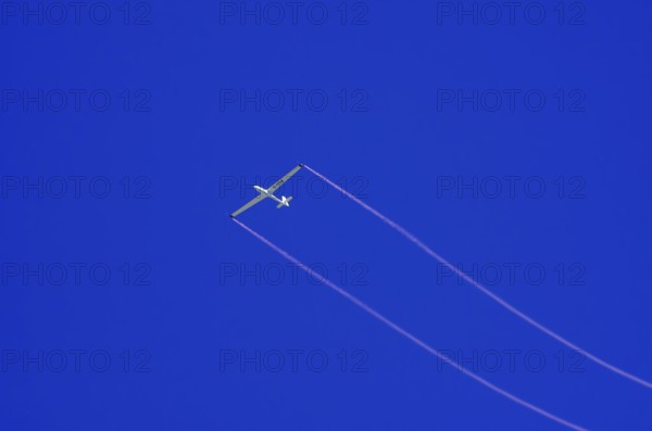 An SZD-59-1 ACRO glider, registration D-1138, during a demonstration as part of an air show at the Fliegerbergfest of the Rossfeld Luftsportverein in Metzingen-Glems, Baden-Württemberg, Germany, for editorial use only