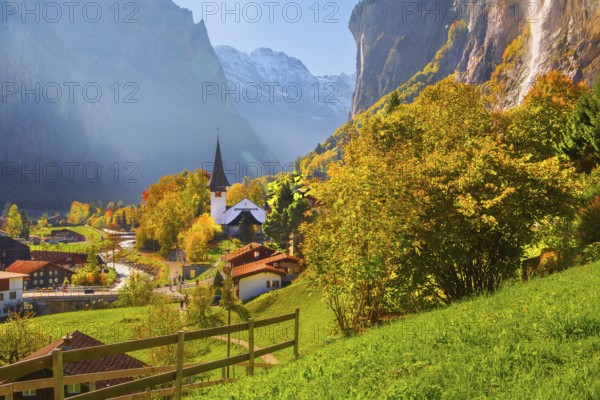 View of town and valley with Staubbach waterfall in autumn, Lauterbrunnen, Bernese Oberland, Canton of Bern, Switzerland