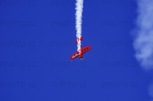 A Soviet Jakovlev Jak-55 sport aircraft with the registration LY-TOY during a flight demonstration as part of an air show on Rossfeld in Metzingen-Glems, Baden-Württemberg, Germany, for editorial use only