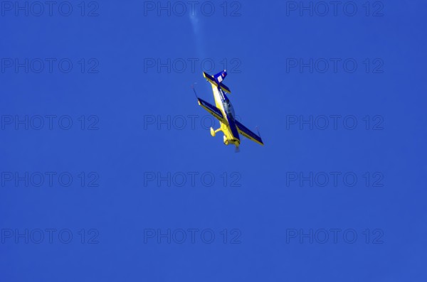 An Extra EA-300 from Extra Flugzeugproduktions- und Vertriebs GmbH with registration D-EXBH during a flight demonstration as part of an air show on Rossfeld in Metzingen-Glems, Baden-Württemberg, Germany, for editorial use only