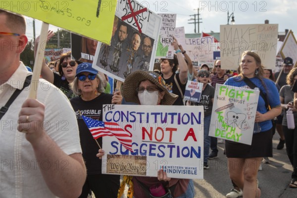 Detroit, Michigan USA - 18 October 2025 - A large crowd gathered for a 'No Kings' rally, protesting President Trump's actions against immigrants and against democratic institutions