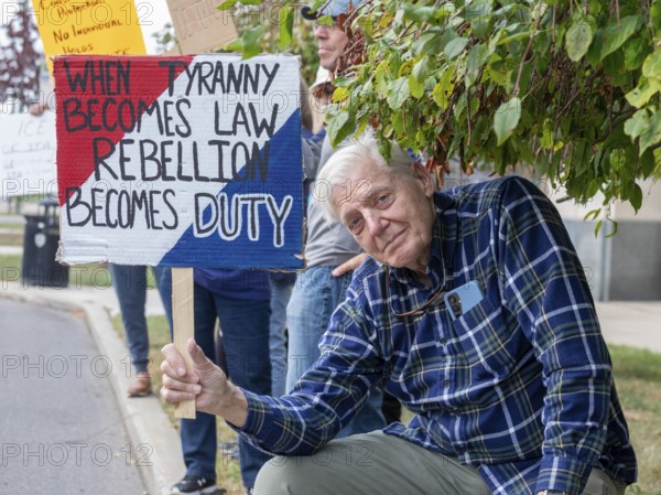 Detroit, Michigan USA - 18 October 2025 - Protesters from Detroit and Grosse Pointe gathered on the border between their cities for a 'No Kings' rally, protesting President Trump's actions against immigrants and against democratic institutions