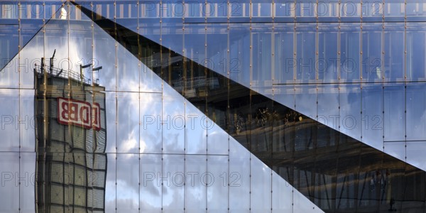 Cube Berlin, cube-shaped office building with folded glass façade reflecting the surroundings, detail, Washingtonplatz, Berlin, Germany