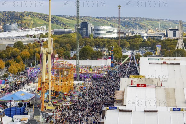 The 178th Cannstatter Volksfest on the Wasen attracted 4.2 million visitors. The Wasenrummel is one of the most important traditional festivals in Germany. In the background is the headquarters of Mercedes-Benz Group AG. Bad Cannstatt, Stuttgart, Baden-Württemberg, Germany