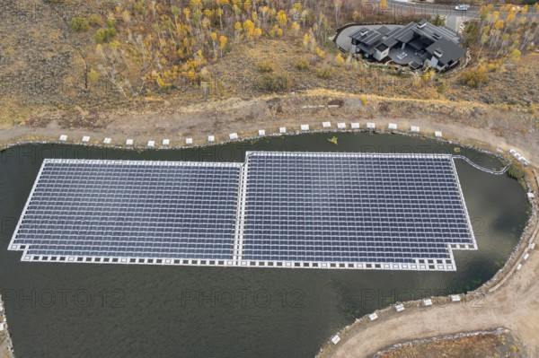 Park City, Utah - Floating solar panels provide power for Mountain Regional Water. The solar array is on the raw water storage pond at the water utility's Signal Hill Treatment Plant