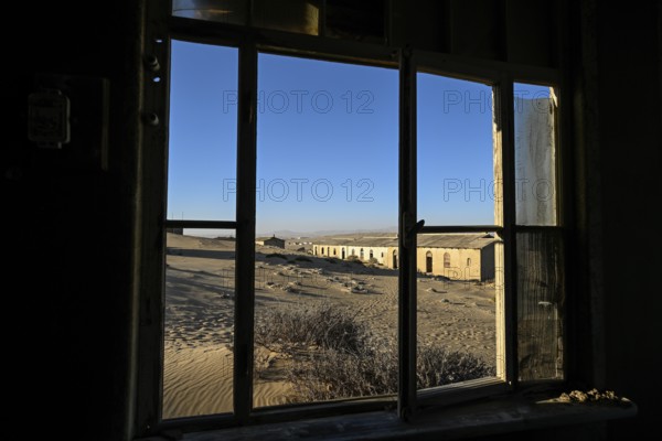 View from a former dwelling house into the desert, Kolmanskop, restricted diamond area, Karas region, Namibia