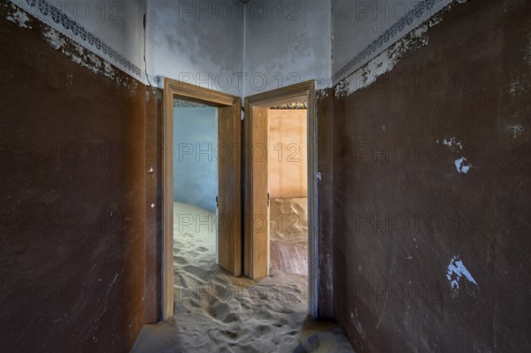 Sand mountains in a former dwelling house, interior photograph, Kolmanskop, restricted diamond area, near Lüderitz, Karas region, Namibia