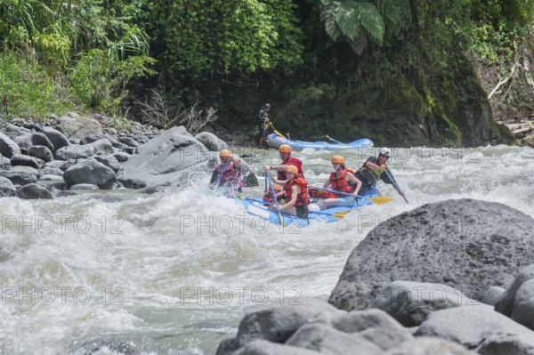 A group of people white water rafting, Costa Rica, Central America
