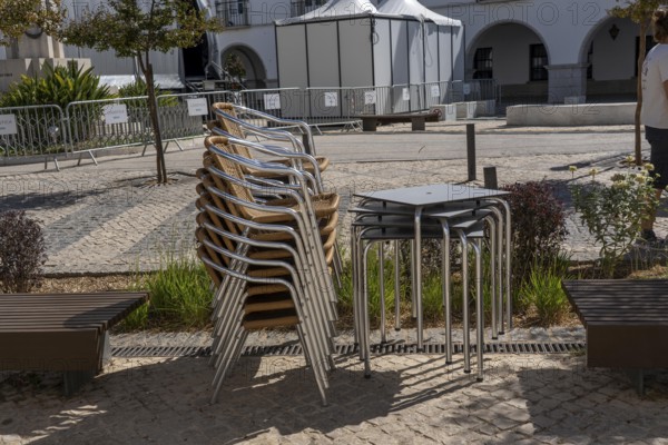 Restaurant furniture, for outdoor catering, tables, chairs, stacked, day off, catering closed, old town of Tavira, Algarve, Portugal