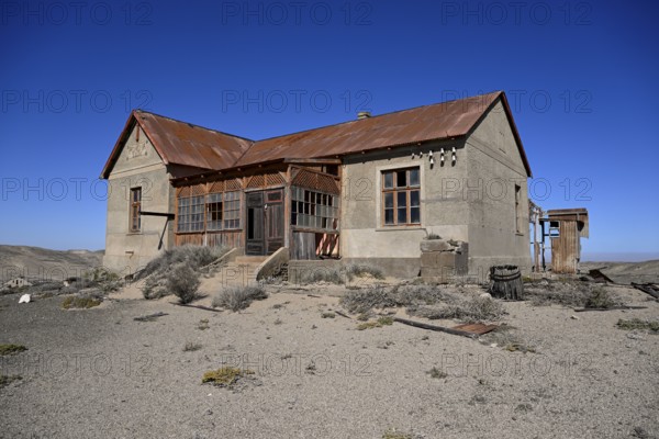 Dilapidated building in the desert sand, Pomona, restricted diamond area, near Lüderitz, Karas region, Namibia