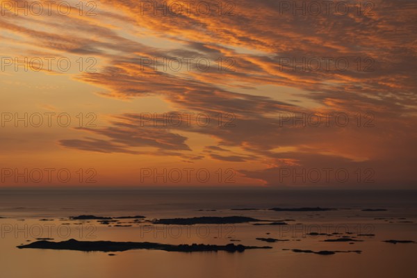 Offshore islands and skerries, sea, dramatically illuminated clouds, sunset, Otroya or Otrøya island, Møre og Romsdal, Norway