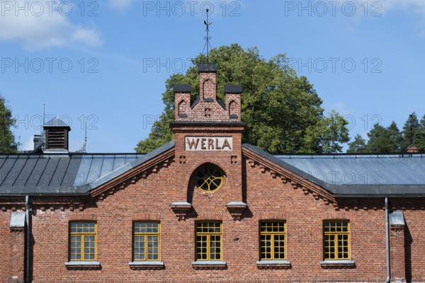Brick façade with inscription Werla, former paper factory and mill for the production of groundwood pulp board, UNESCO World Heritage Site Factory Village Verla, Maailmanperintökohde Verlan puuhiomo ja pahvitehdas, Verla Rapids, Kymenlaakso, near Kouvola, Finland