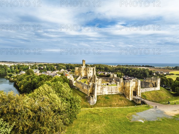 Warkworth Castle over River Coquet from a drone, Warkworth, Northumberland, England, United Kingdom