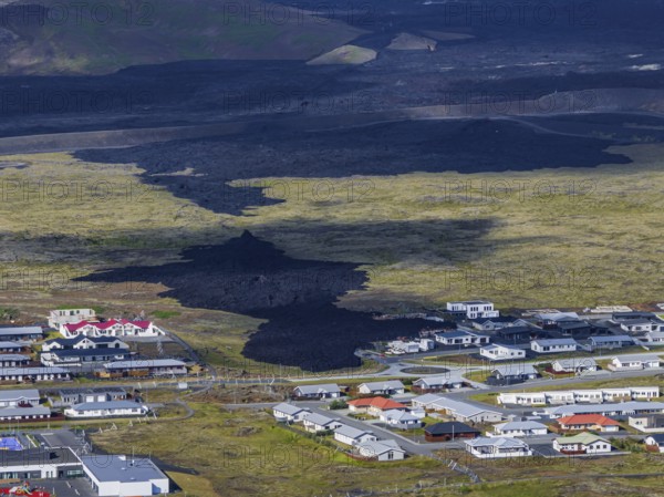 Lava, lava field, village, houses, summer, cloudy, sunny, aerial view, volcanic eruption, July 2025, Grindavik, Sundhnúkur crater series, Fagradalsfjall, Reykjanes, Iceland