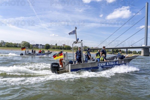 Multi-purpose boat of the THW during a training trip on the Rhine near Düsseldorf, the specialist group for water hazards, this type of boat is used to transport people and goods as a rescue boat and as a working platform, during the major exercise FÜLEX25, lasting several days, of the THW, Technical Relief Organisation, North Rhine-Westphalia regional association, over 3500 volunteers from the 127 North Rhine-Westphalia local associations practise many different deployment scenarios over 4 weekends