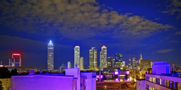 Rooftop day with colourfully illuminated houses for a techno party on the roof with a view of the skyline, Frankfurt am Main, Hesse, Germany