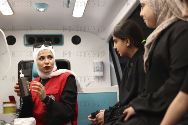 Syrian Arab Red Crescent volunteers conduct first aid training for children during the Damascus International Fair, the first edition held after the fall of Bashar al-Assad. The activity raises awareness of health, safety, and emergency preparedness among young visitors, Damascus, Damascus, Syria