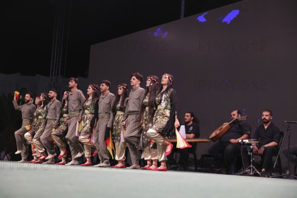 A Kurdish traditional dance troupe performs during the Damascus International Fair, the first edition held after the fall of Bashar al-Assad, showcasing cultural heritage and attracting visitors to the exhibition, Damascus, Damascus, Syria