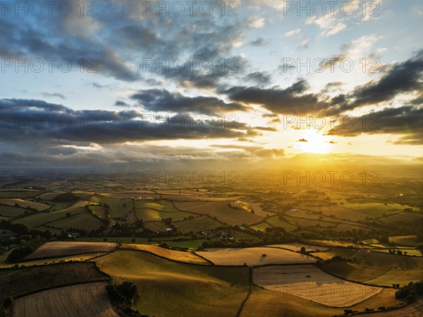 Sunset of Fields and Farms over Devon from a drone, Torquay, Torbay, Devon, England, United Kingdom