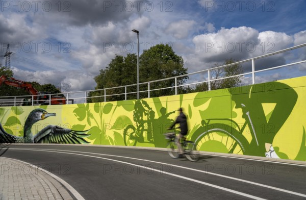 New bicycle tunnel at the junction of the B51 and Warendorfer Straße, in Münster, a bicycle and pedestrian tunnel, 150 metres long, 5.50 metres wide, crosses under the busy roads so that cyclists and pedestrians can pass without crossing, route to and from Münster city centre, visually designed with local motifs as murals, by Lackaffen.de, modern bicycle infrastructure, North Rhine-Westphalia, Germany