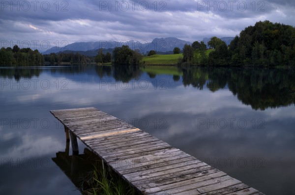 Bathing jetty, jetty, wooden jetty, jetty, leads into a lake, bathing lake, Schwaltenweiher near Seeg, Allgäu Alps, East Allgäu, Allgäu, Swabia, Bavaria, Germany